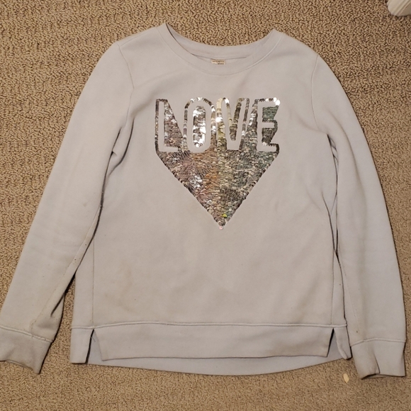 A sweater which has sequins on the front. - Picture 2 of 3